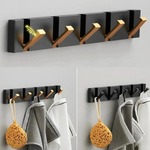 Gancho de pared abatible para almacenamiento sin desorden