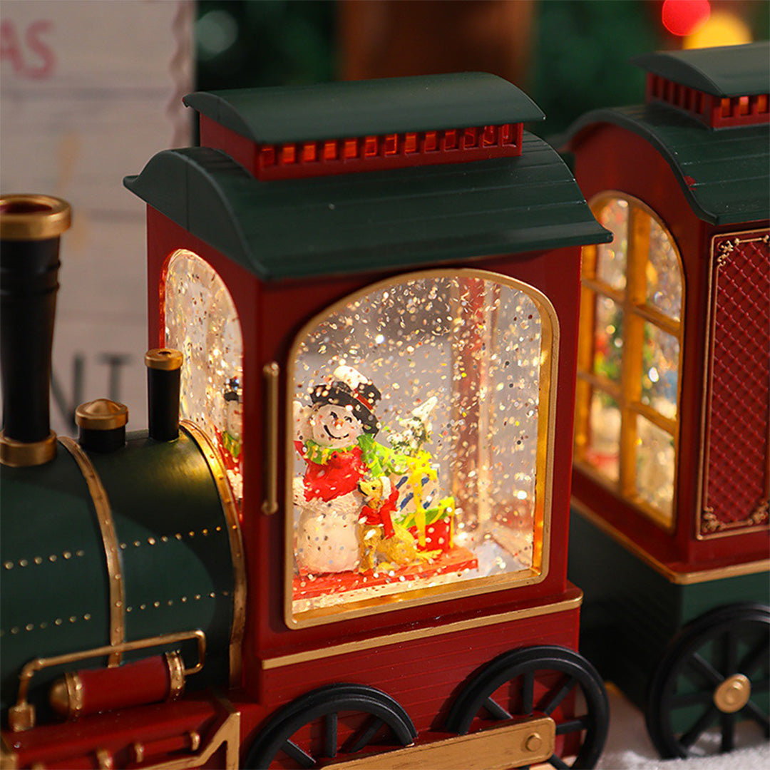 Weihnachtszug-Lichter mit Schneefall-Glanz