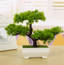 Bonsai con fiori artificiali per decorare facilmente la tavola